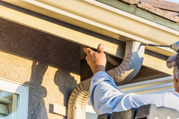 Fascia board installation with gutter system.