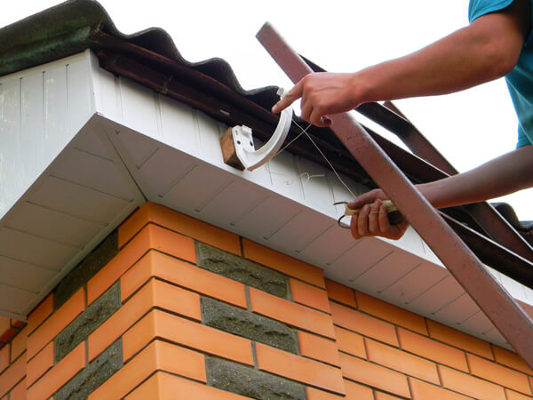 Rain gutter system with fascia and soffit repair.