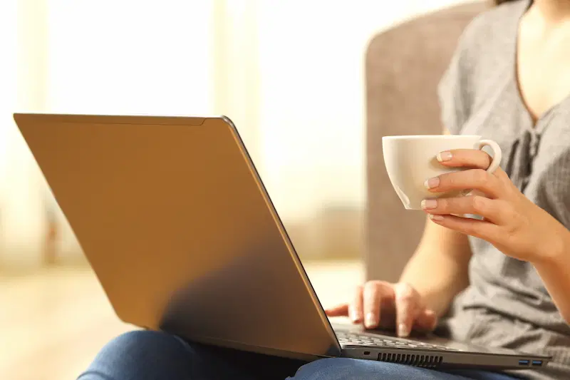 A woman searching online for a roofing contractor