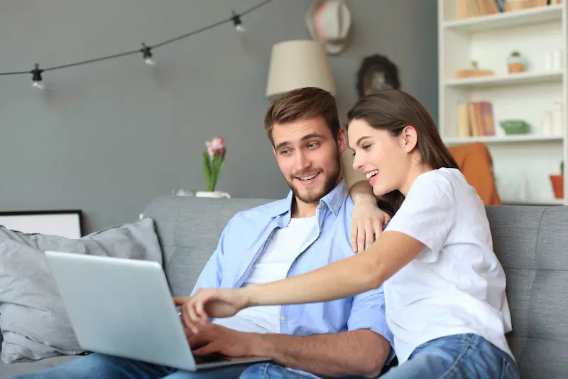 Couple getting roofing quotes online